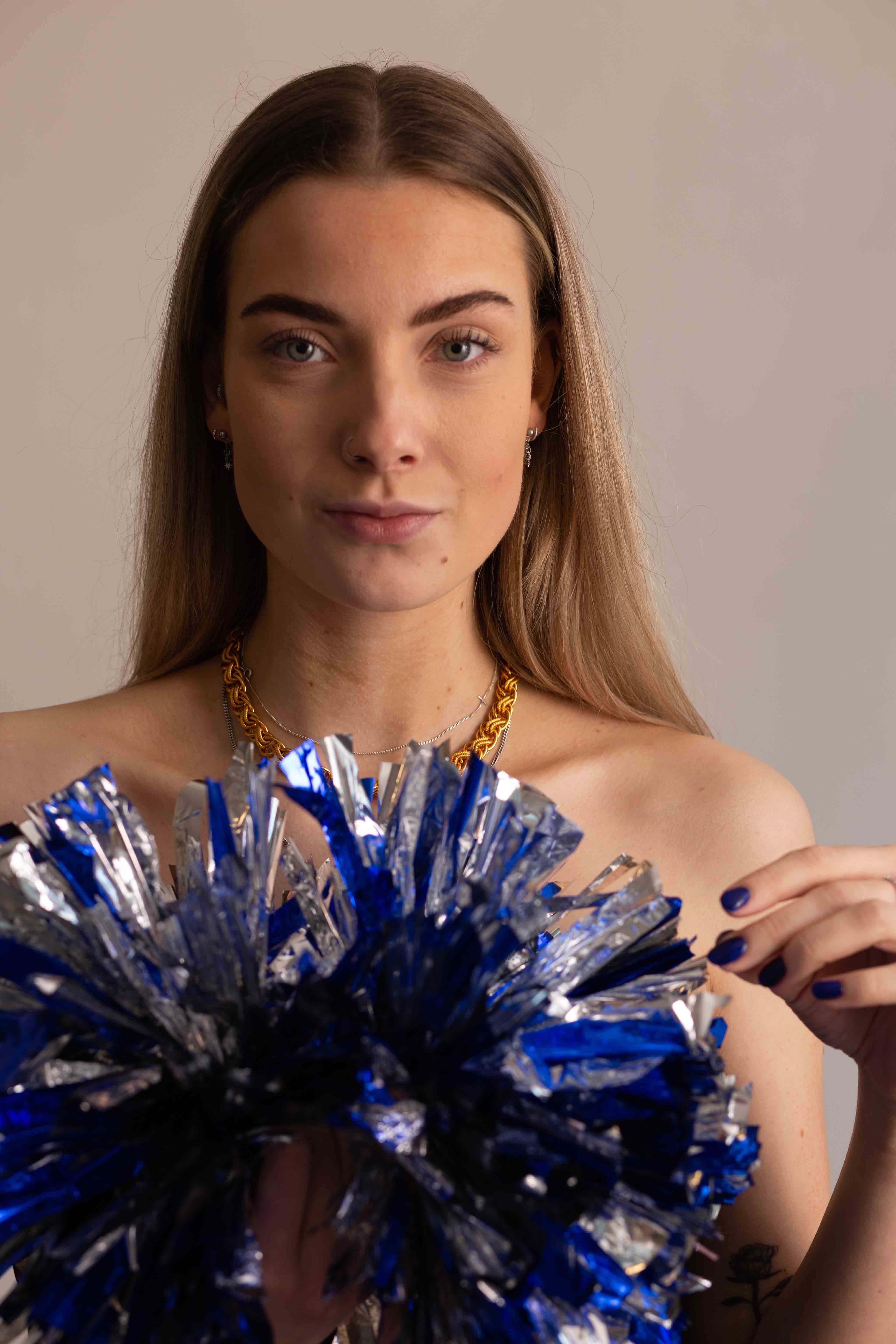 blonde portrait long hair wtih pom poms