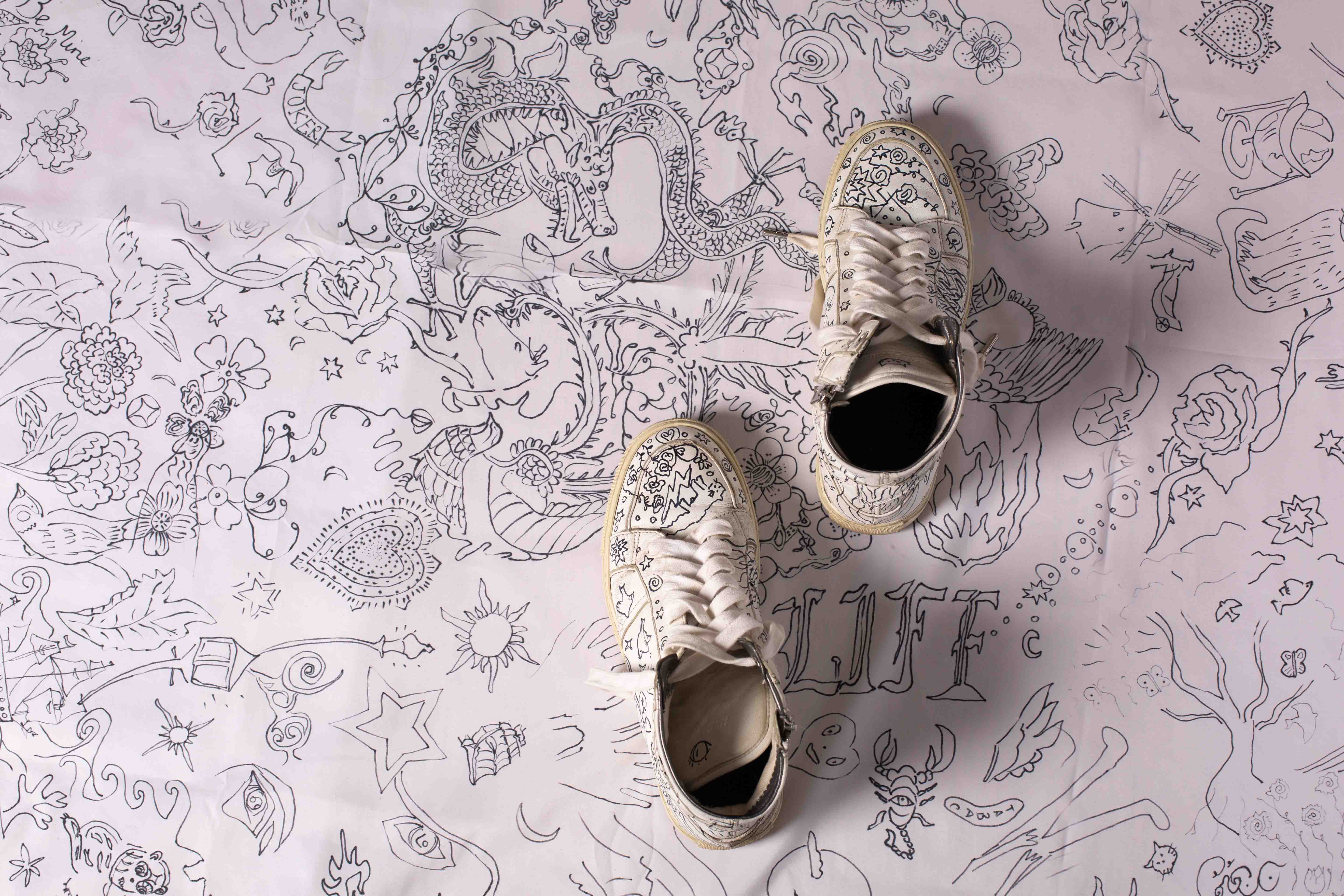 shoes over tattoo background