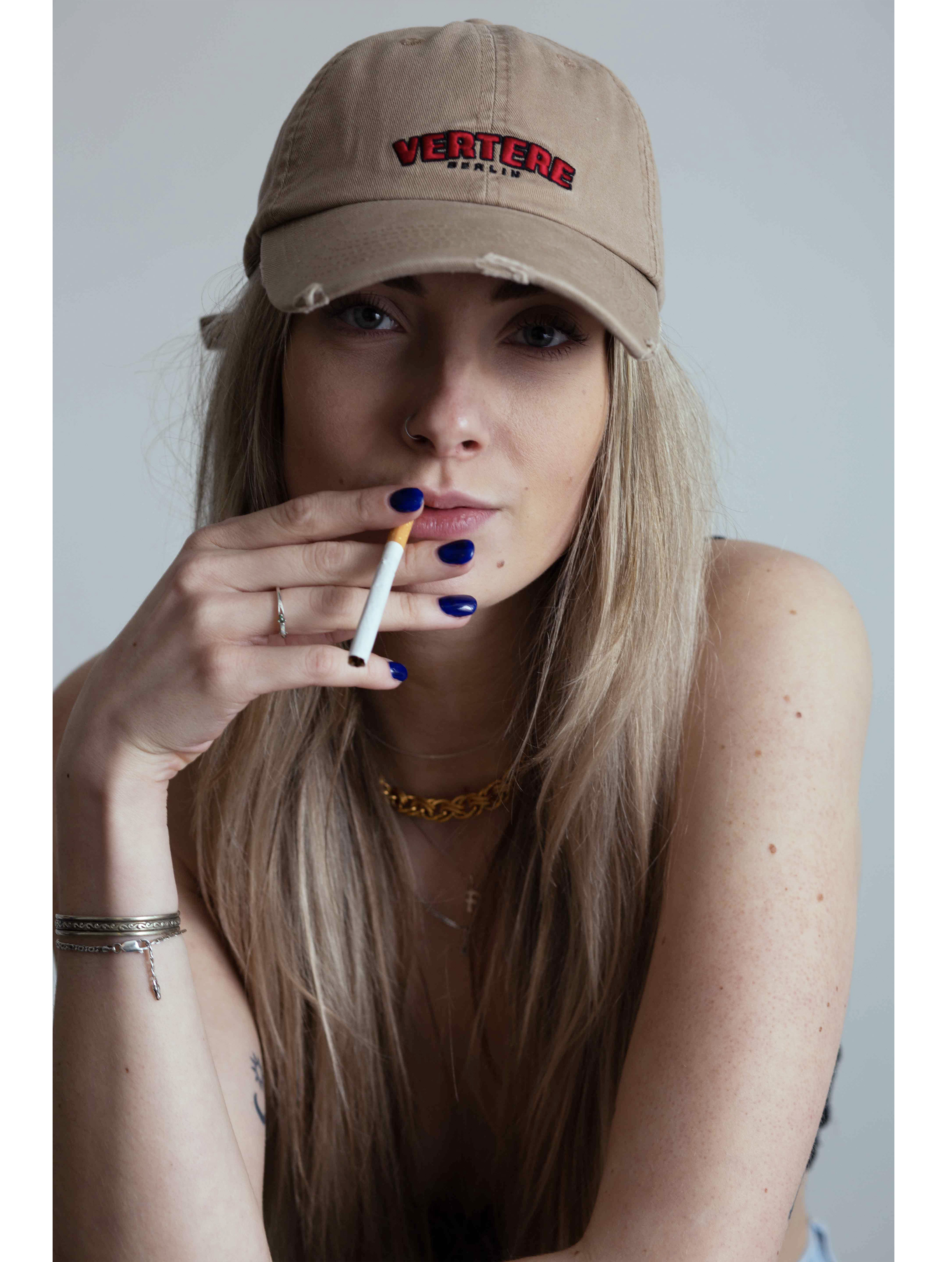 fab with cigarette and cap blonde model